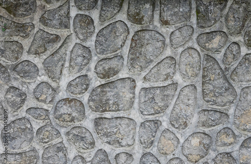 Wall decorated with cemented stones.