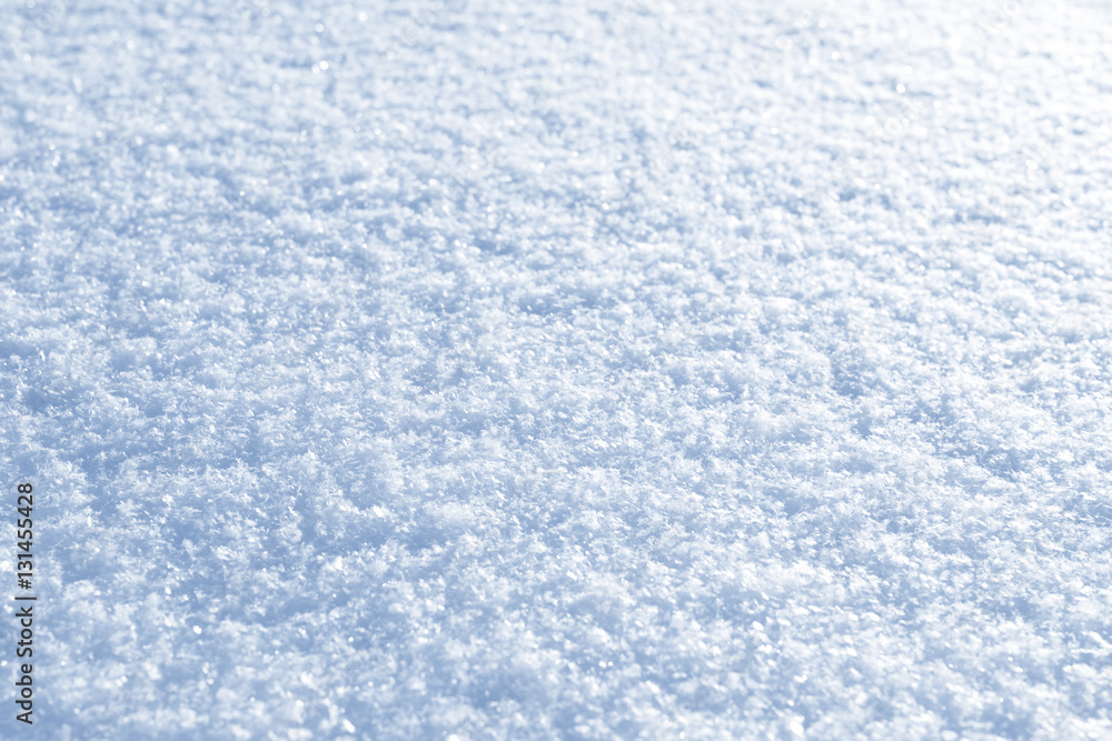 Fresh snow background texture. Winter background with snowflakes and snow mounds. Snow lumps