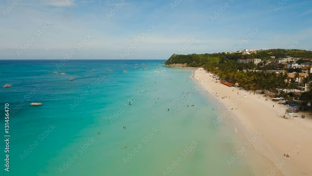 Aerial view of beautiful tropical island with white sand beach, hotels and tourists. Tropical lagoon with turquoise water and white sand. Beautiful sky, sea, beach, resort. Beautiful tropical beach of Aerial view of beautiful tropical island with white sand beach, hotels and tourists. Tropical lagoon with turquoise water and white sand. Beautiful sky, sea, beach, resort. Beautiful tropical beach of