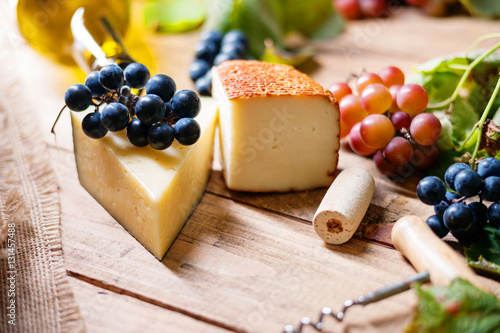 Cheese, grape and wine cork 