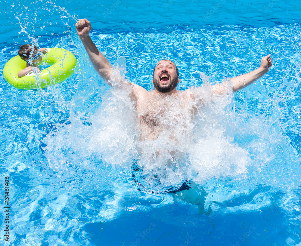 Excited man in water pool