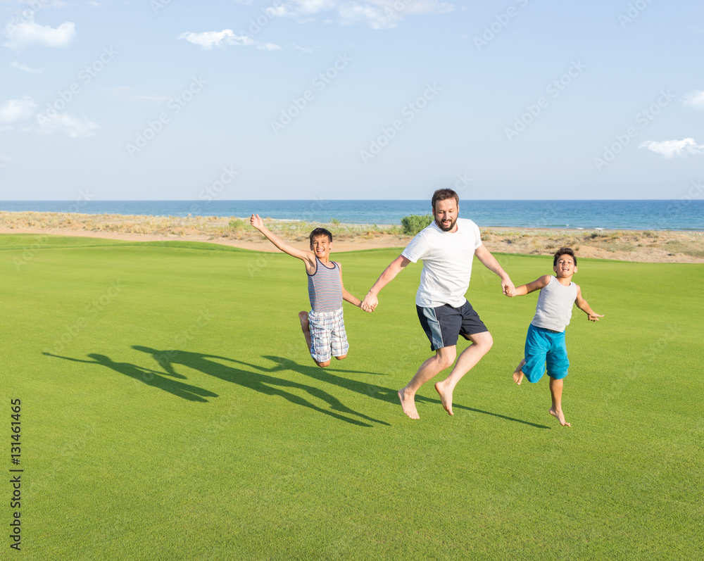 Happy children on summer gulf grass terrain having fun and happy Happy children on summer gulf grass terrain having fun and happy