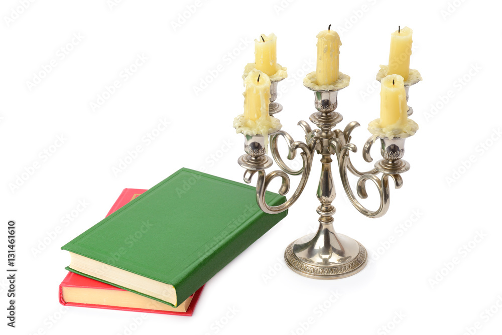 candlestick and books isolated on white background candlestick and books isolated on white background