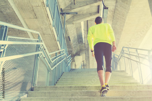 Urban jogger on a big bridge. 