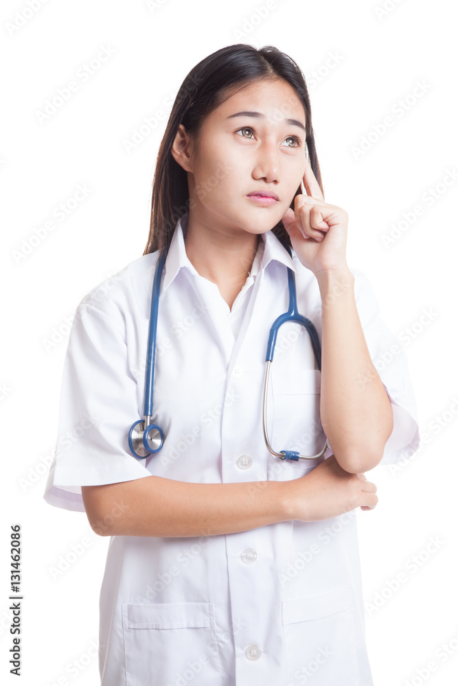 Asian young female doctor thinking looking up. Asian young female doctor thinking looking up.