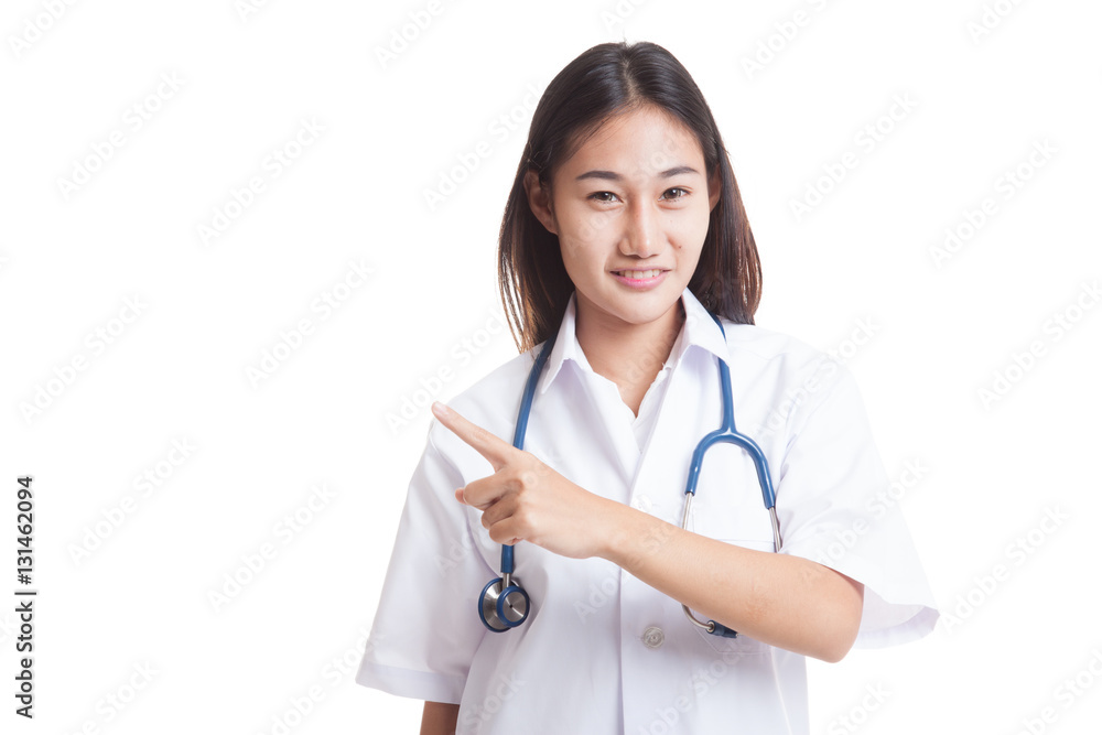 Asian young female doctor point to blank space. Asian young female doctor point to blank space.