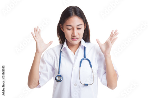 Frustrated Asian young female doctor.
