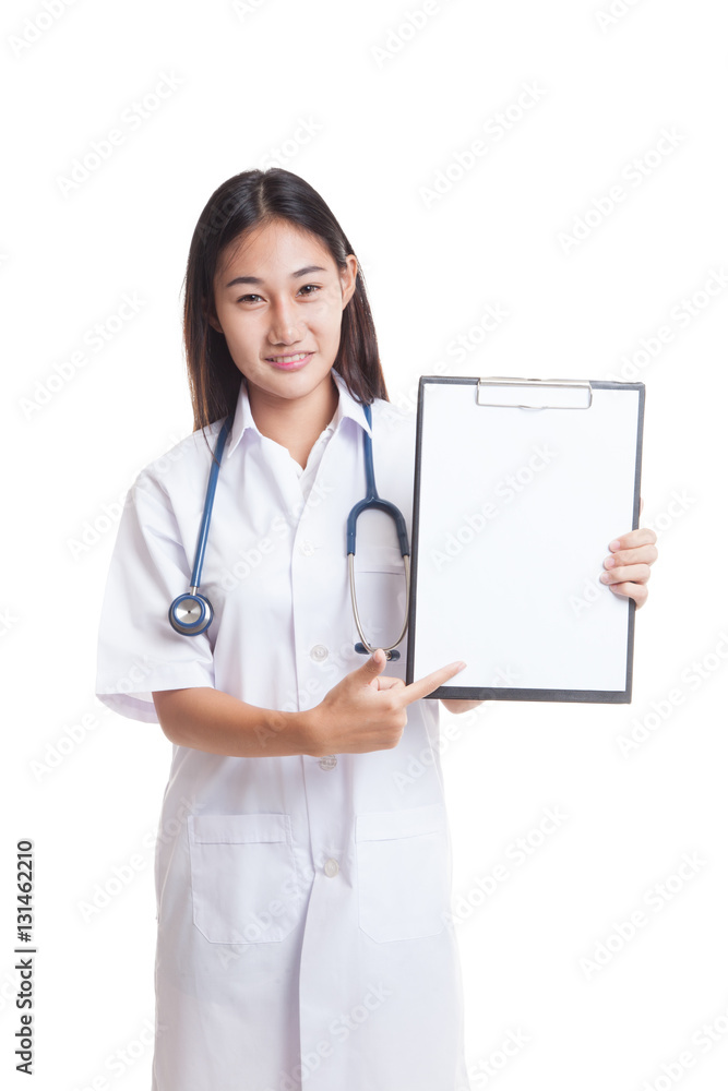 Young Asian female doctor point to a blank clipboard.