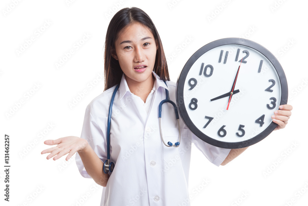 Angry Young Asian female doctor with a clock. Angry Young Asian female doctor with a clock.