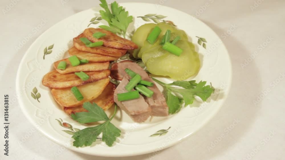 A dish of roasted potatoes with meat. Very tasty homemade food A dish of roasted potatoes with meat. Very tasty homemade food