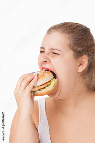 fat woman eating a burger