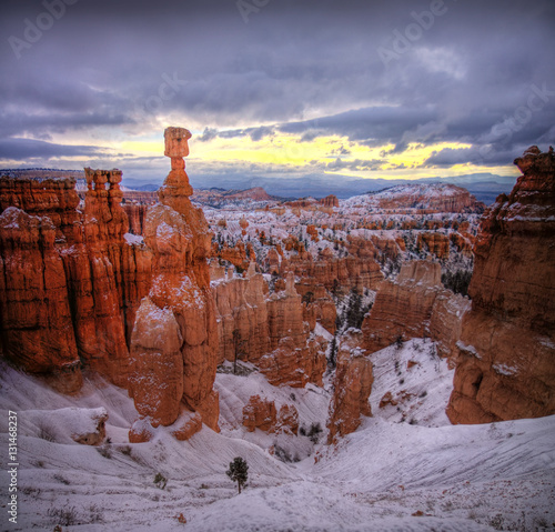 Thor's Hammer Spotlight at Sunrise - The iconic Thor's Hammer formation is highlighted by a crack of sunlight in the clouds at sunrise at Sunset Point in Bryce Canyon National Park, Utah.