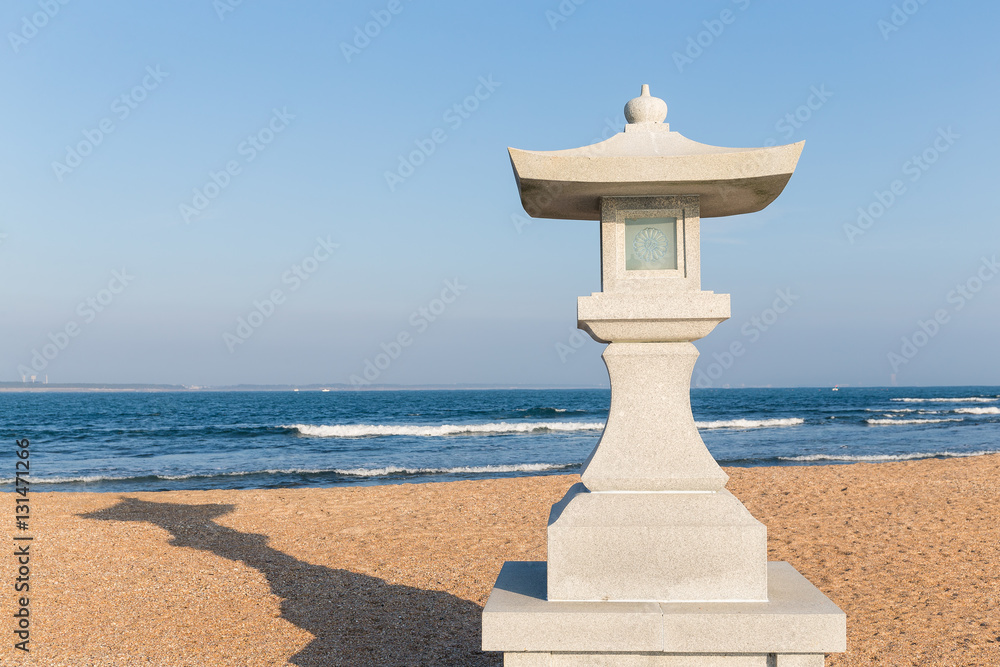 Fototapeta premium Stone lantern in the beach