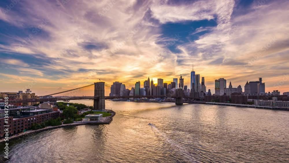 New York City time lapse from above the East River from day to night.