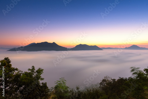 sunrise and fog and mountain in thailand