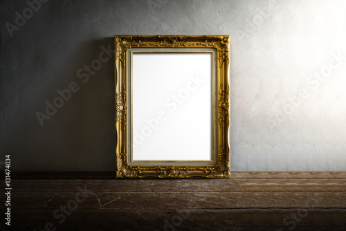 luxurious photo frame on wooden table over grunge background