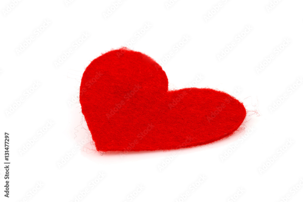 Fototapeta premium red heart made of felt inclined on a white background