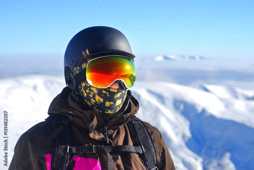 Portrait of a boy in a protective helmet and snowboard mask agai Portrait of a boy in a protective helmet and snowboard mask agai