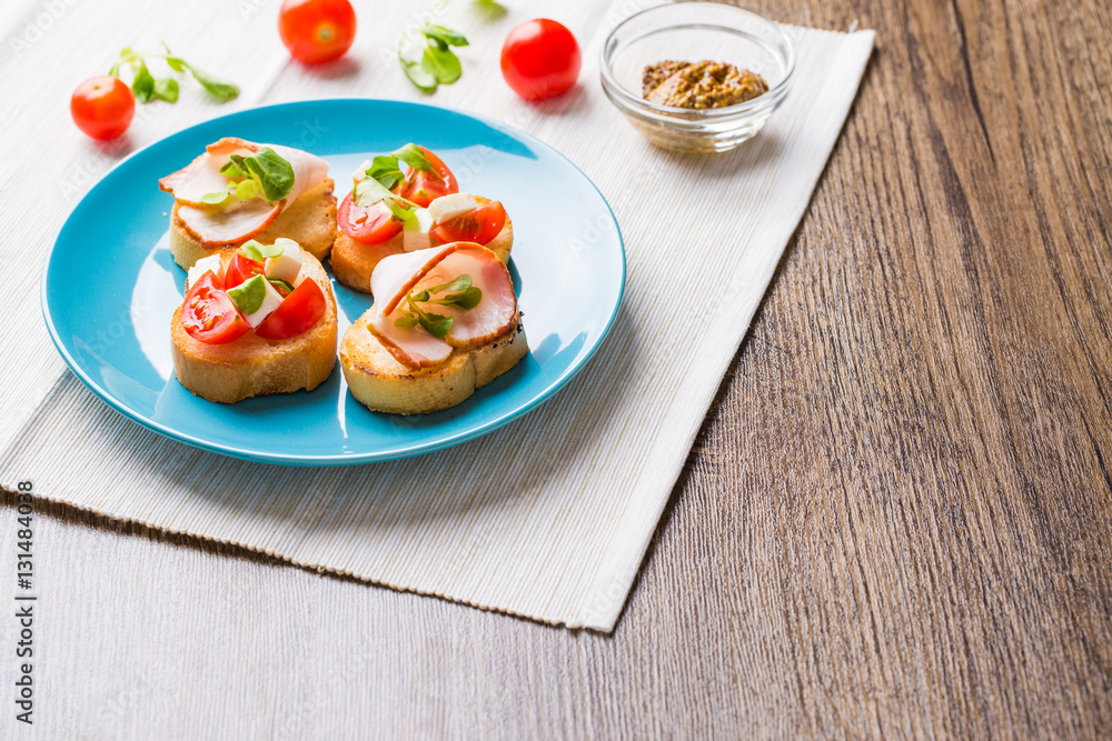 Bruschetta with tomato, cheese and bacon Bruschetta with tomato, cheese and bacon