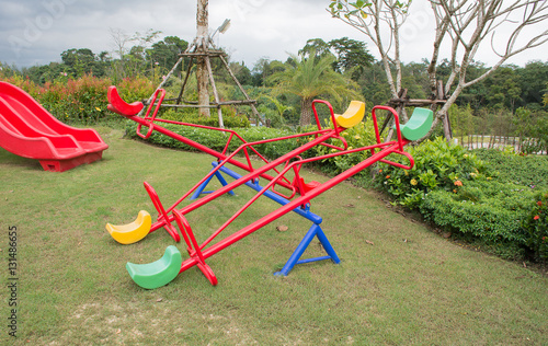 Colourful Seesaw (kids playground equipment)at the kids on the lawn.
