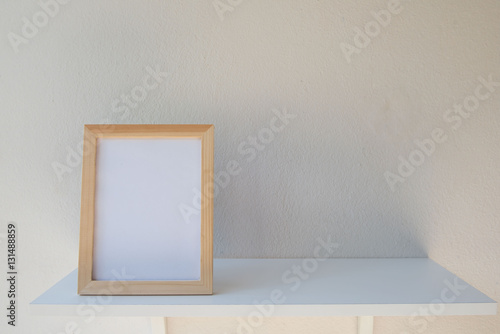 photo Frame on a wooden on White background .