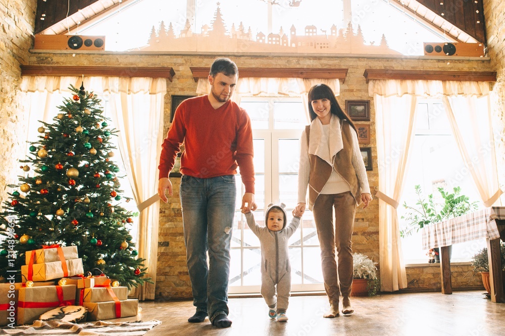 Young family in Christmas interior Young family in Christmas interior