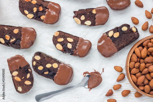 Fotografija Homemade dark chocolate biscotti cookies with almonds, covered with melted choco