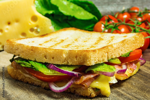 grilled sandwich or panini with bacon, cheese and tomatoes