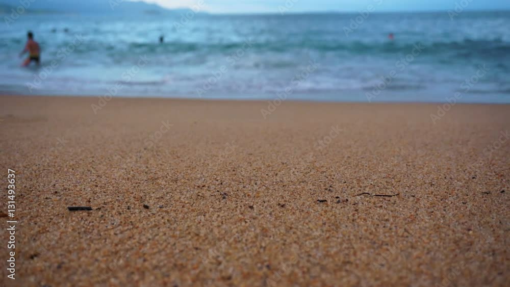 Waves lapping on a sandy beach. A warm summer evening by the sea. Waves lapping on a sandy beach. A warm summer evening by the sea.