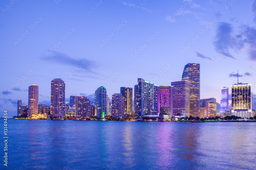 Beautiful Miami Florida skyline with lights and bay at sunset