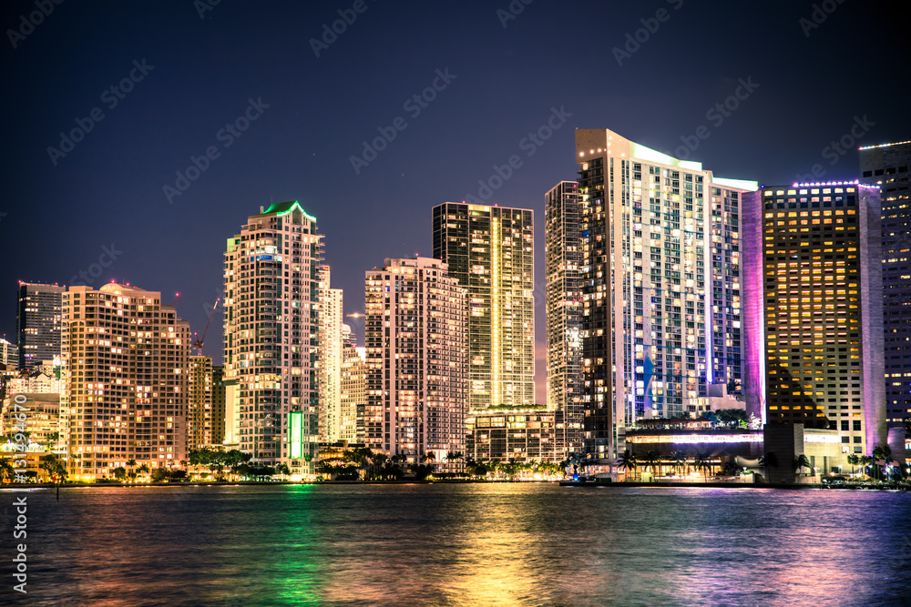 Beautiful Miami Florida skyline with lights and bay at night Stock Photo |  Adobe Stock