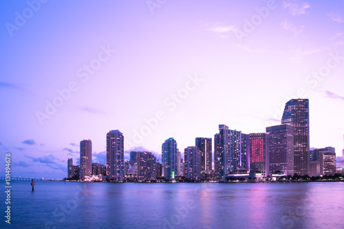 Beautiful Miami Florida skyline with lights and bay at sunset