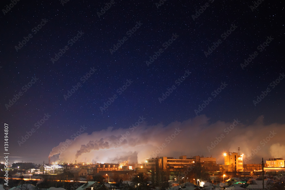 Night  starry sky over an industrial area of the city. Landscape