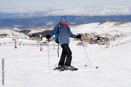 happy man happy in snow mountains at Sierra Nevada ski resort in Spain