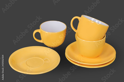 orange cup and saucer