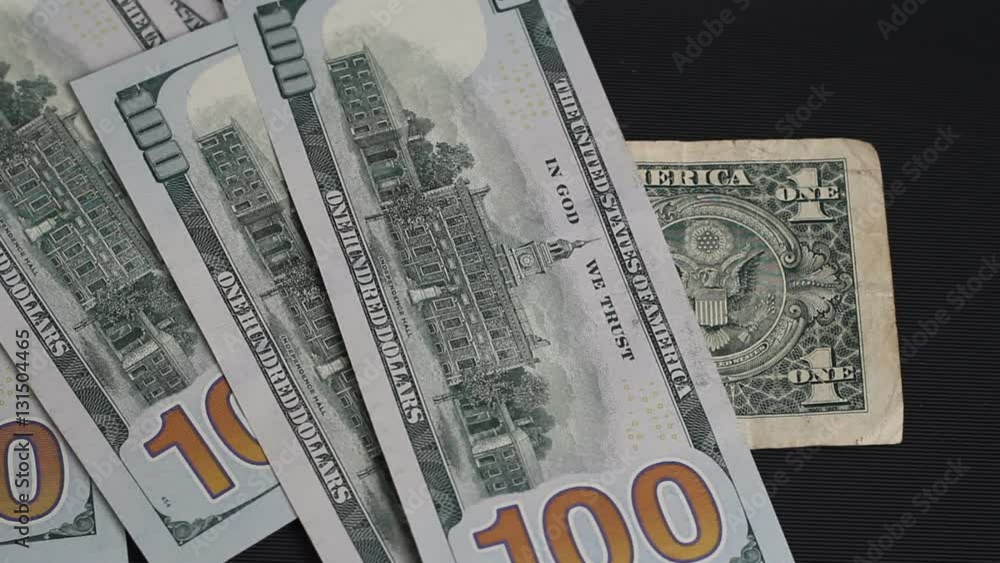 Man throws on the table 100 dollar bills.