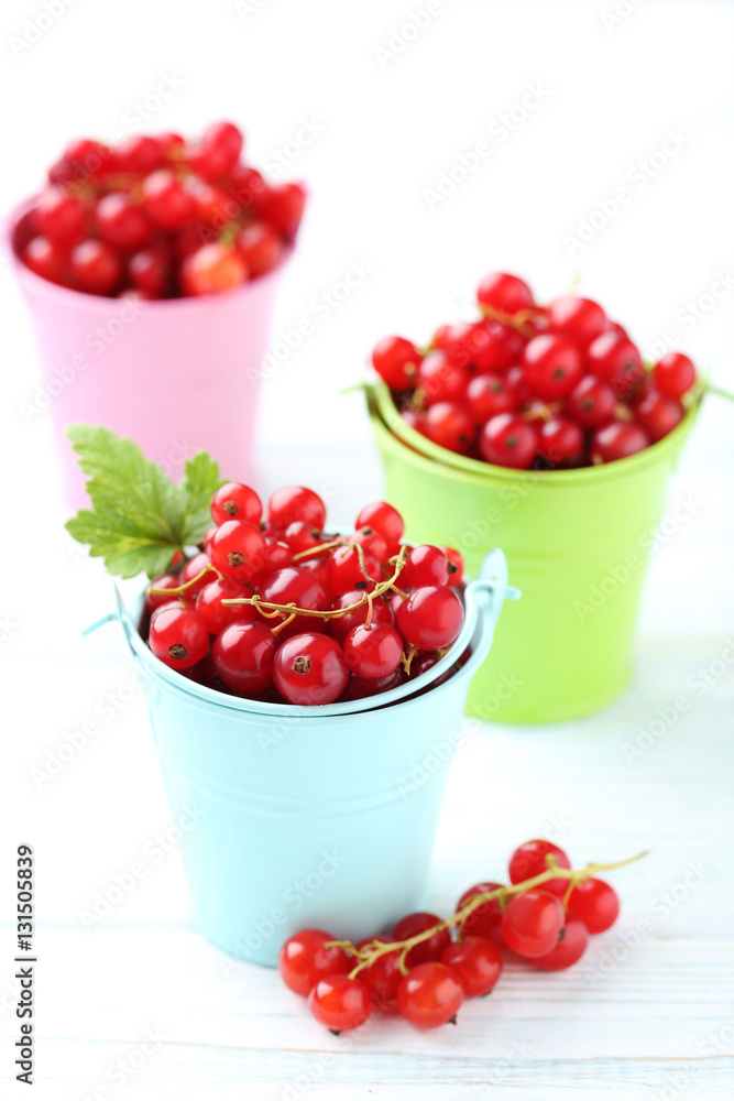 Red currant on a white wooden table Red currant on a white wooden table