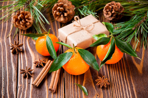 holiday tangerines with fir branches and cones