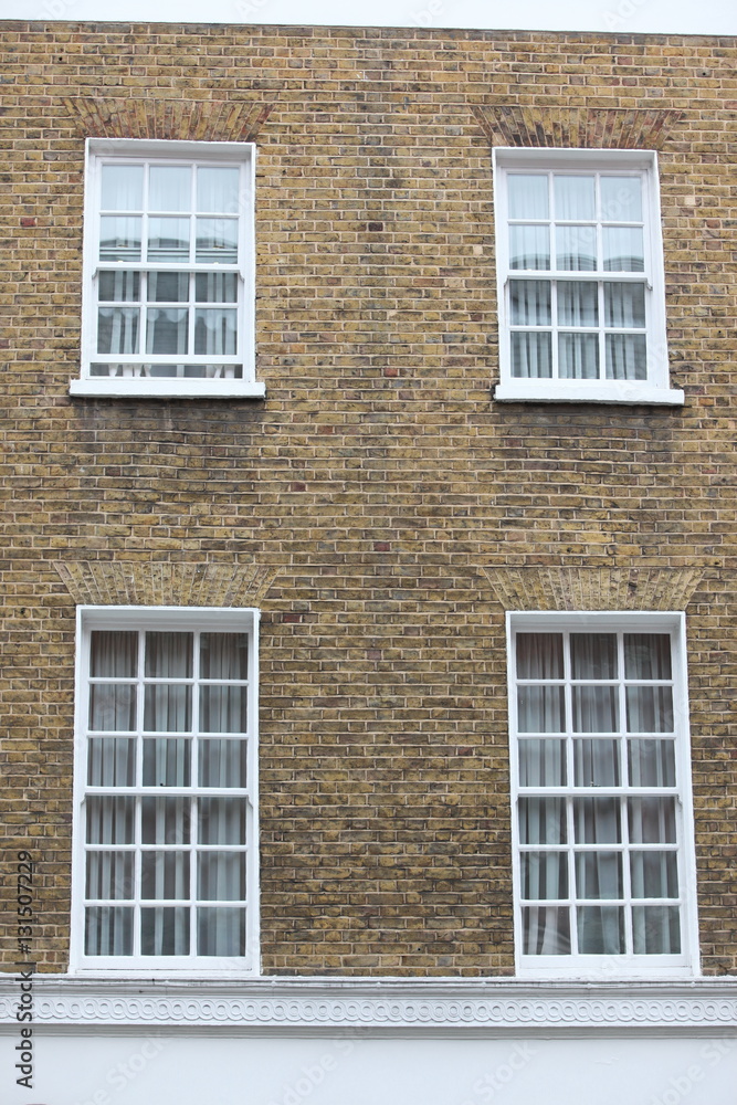 Georgian windows architecture on a wall house, London, UK Georgian windows architecture on a wall house, London, UK