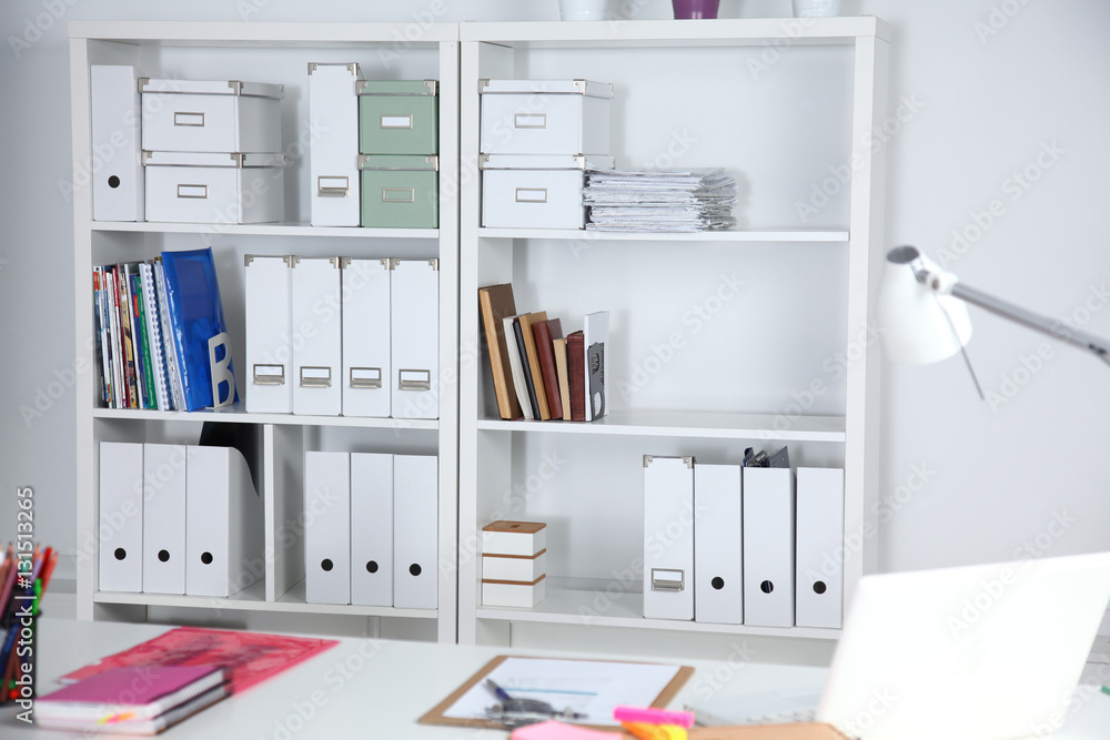 Modern office interior with tables, chairs and bookcases Modern office interior with tables, chairs and bookcases