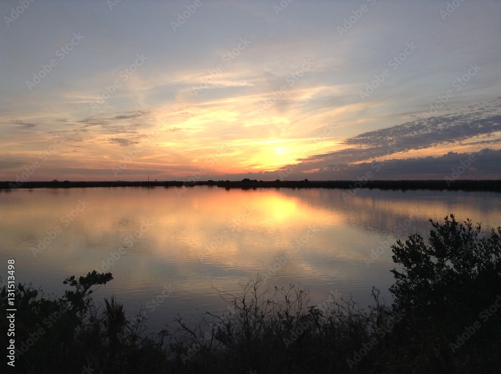 Naklejka premium Sunset over salt marsh Cape Canaveral, FL