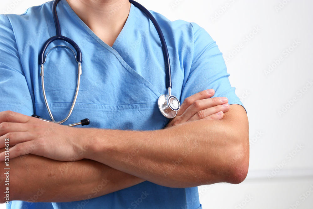 Portrait of a doctor with stethoscope standing isolated on white background Portrait of a doctor with stethoscope standing isolated on white background