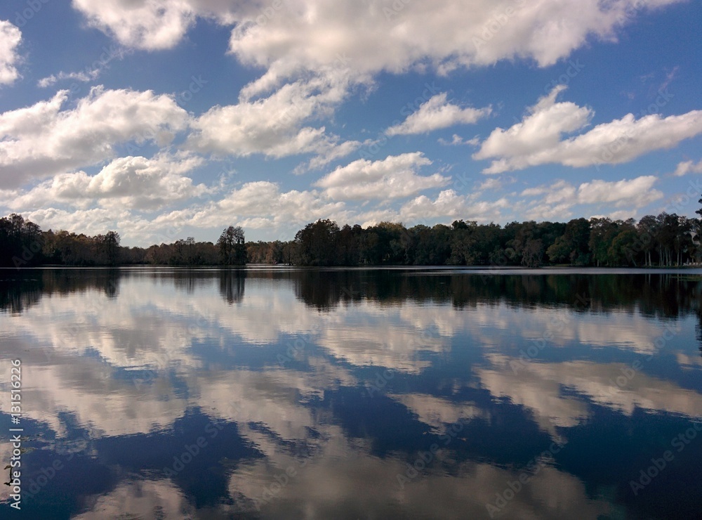 Blue sky reflection in lake water