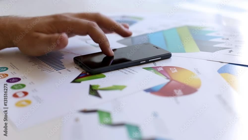 Businessman working in the office with the charts Businessman working in the office with the charts