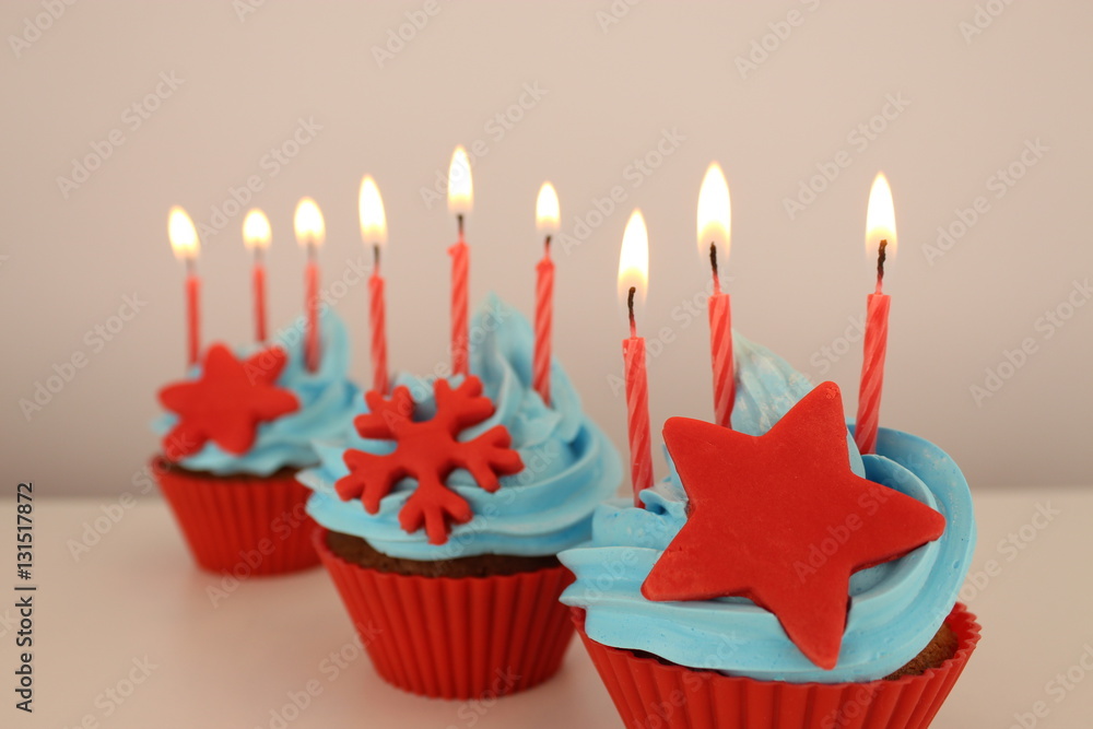 nice cupcakes with candles on white background nice cupcakes with candles on white background