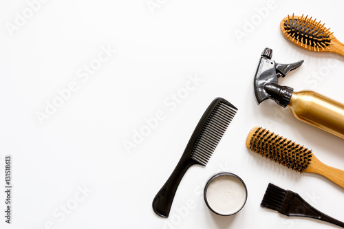 combs and hairdresser tools on white background top view