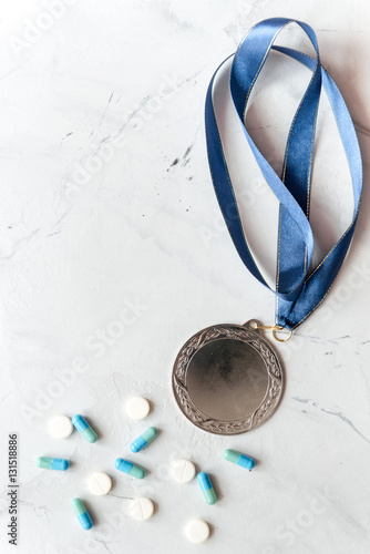 Foto Concept of doping in sport - deprivation medals top view