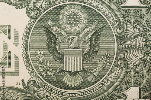 A one dollar bill close up, showing the eagle on the great seal of the United States photo