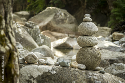 balanced stones in riverbed