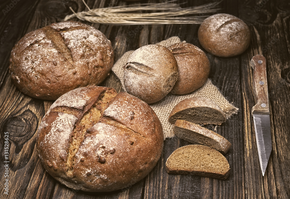 pieces of bread on a board with shallow depth of field